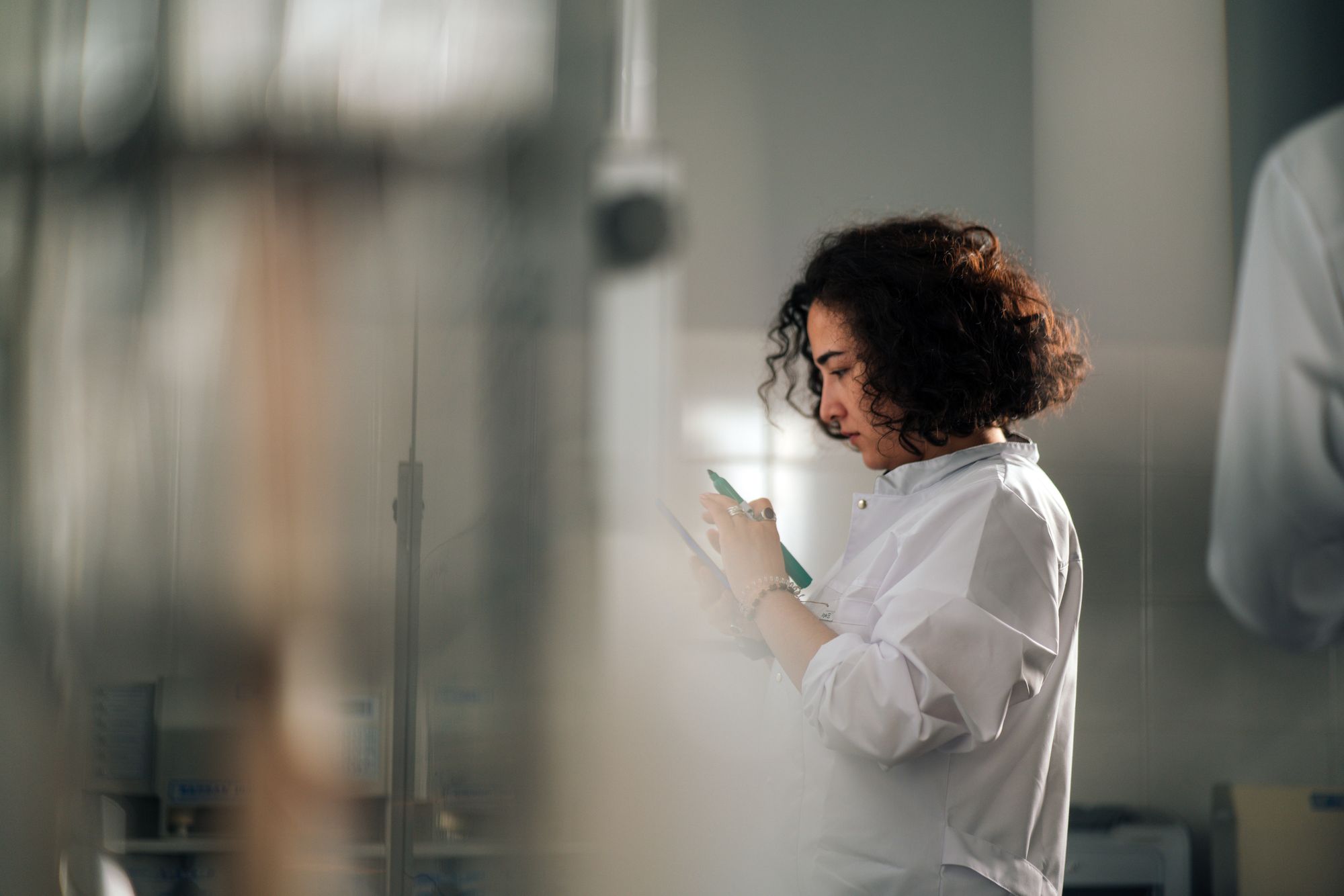Scientist taking notes in a laboratory