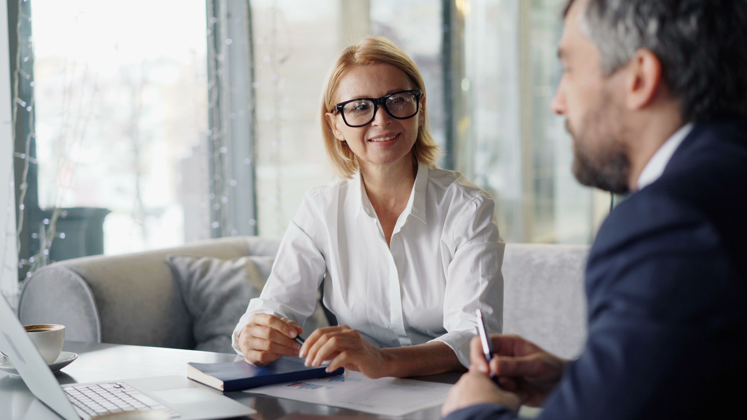 Two people talking in an office